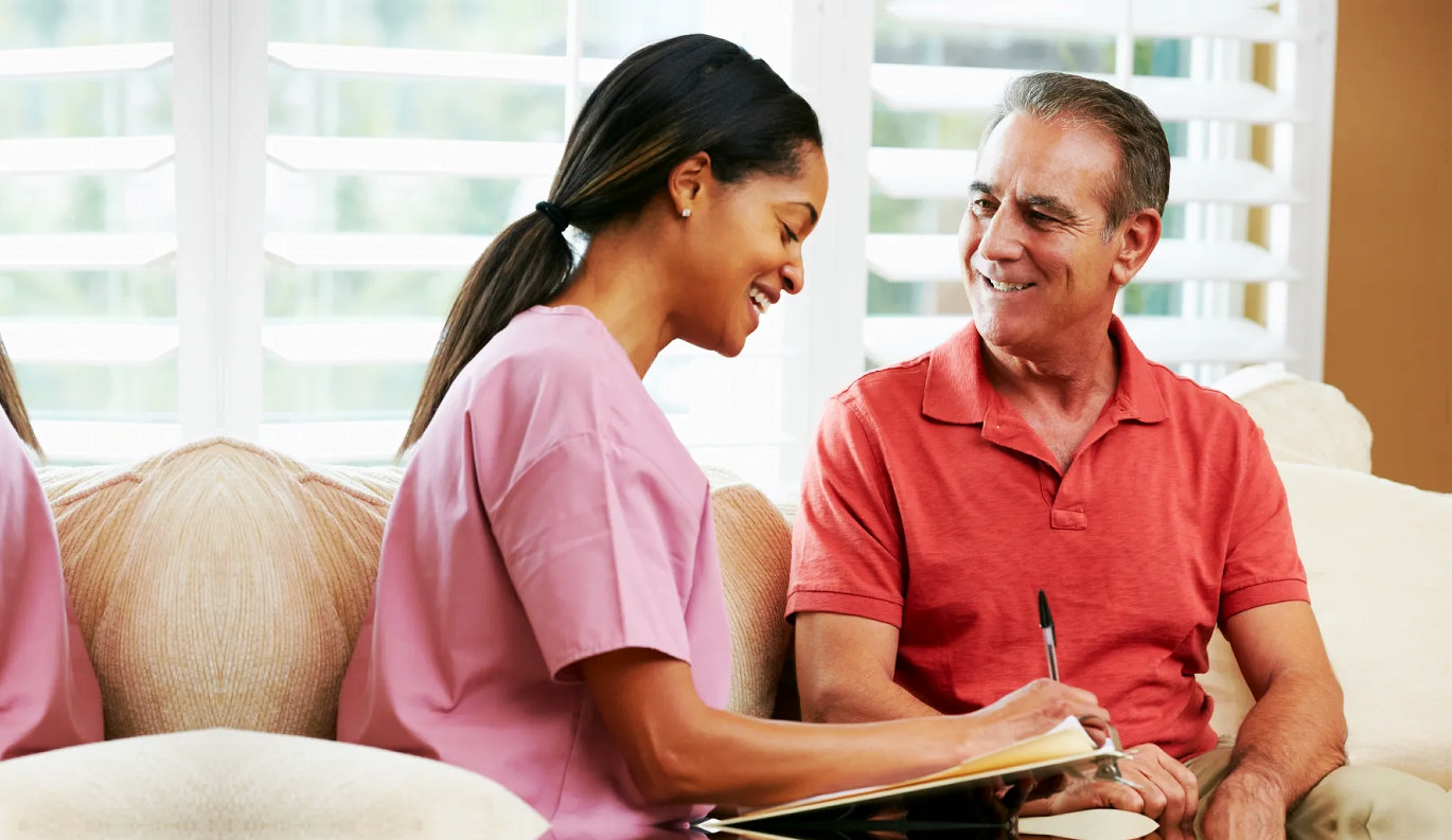 Caring home care professional with client
