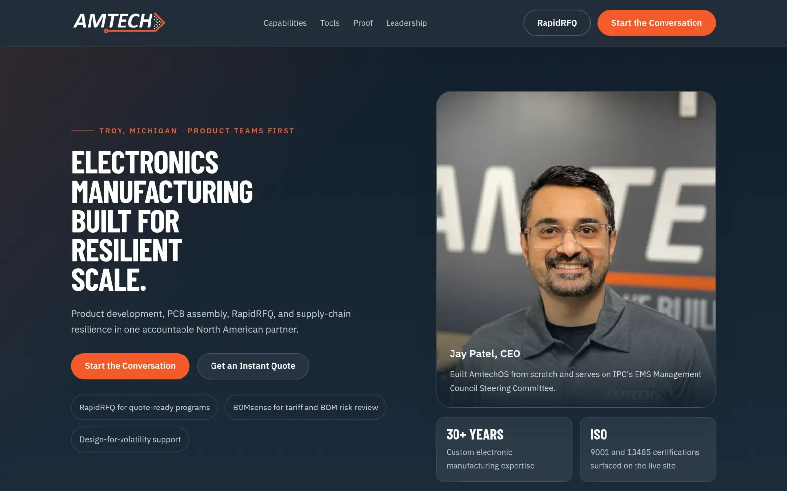 The concept first screen: the headline "Electronics manufacturing built for resilient scale", a Troy, Michigan tag, an orange Start the Conversation button, a Get an Instant Quote button and a photo of CEO Jay Patel with a 30+ years tile and an ISO tile.